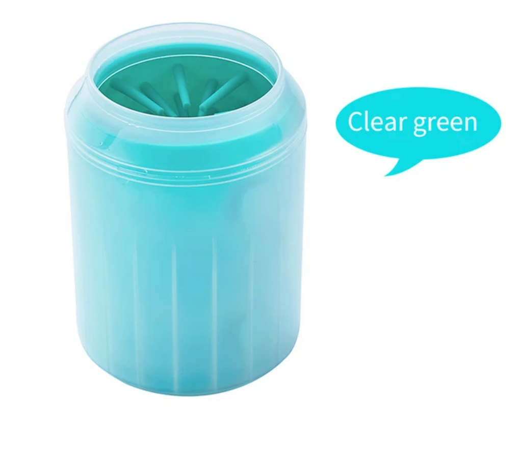 Dog paw cleaner cup being emptied and rinsed after use